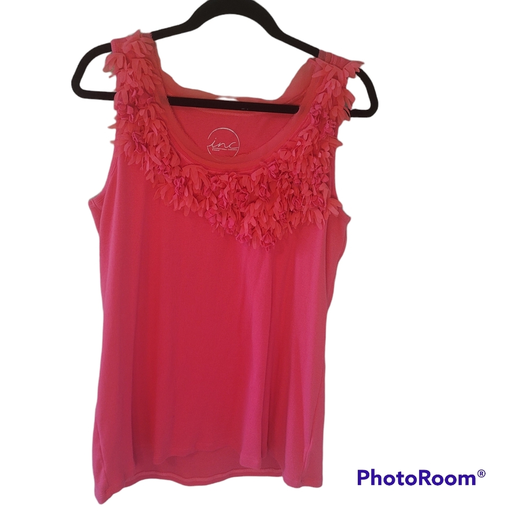 International Concept wo.an pink tee. Ruffled flowers on front.